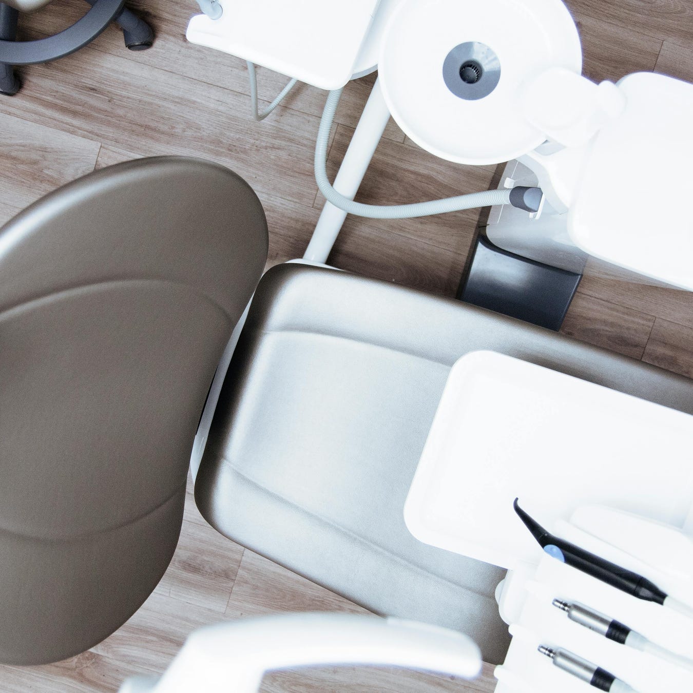 High-angle view of a modern dental chair and equipment setup in a professional clinic.